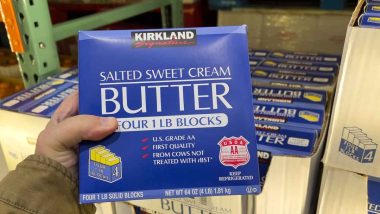 Hand holding Kirkland sweet cream butter, representing Costco recall.