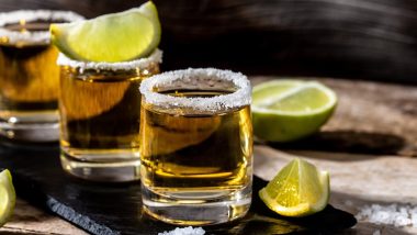 shots of gold Mexican tequila with lime and salt.