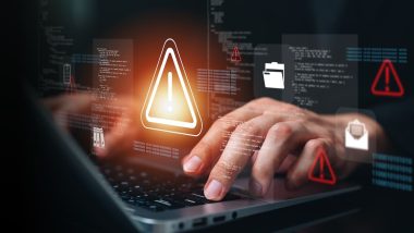 Cybersecurity threat alert on laptop with digital warning interface, malware detection