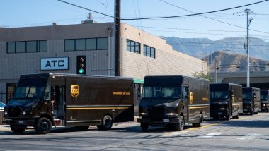 UPS (United Parcel Service) drivers and delivery trucks. Residential delivery service.
